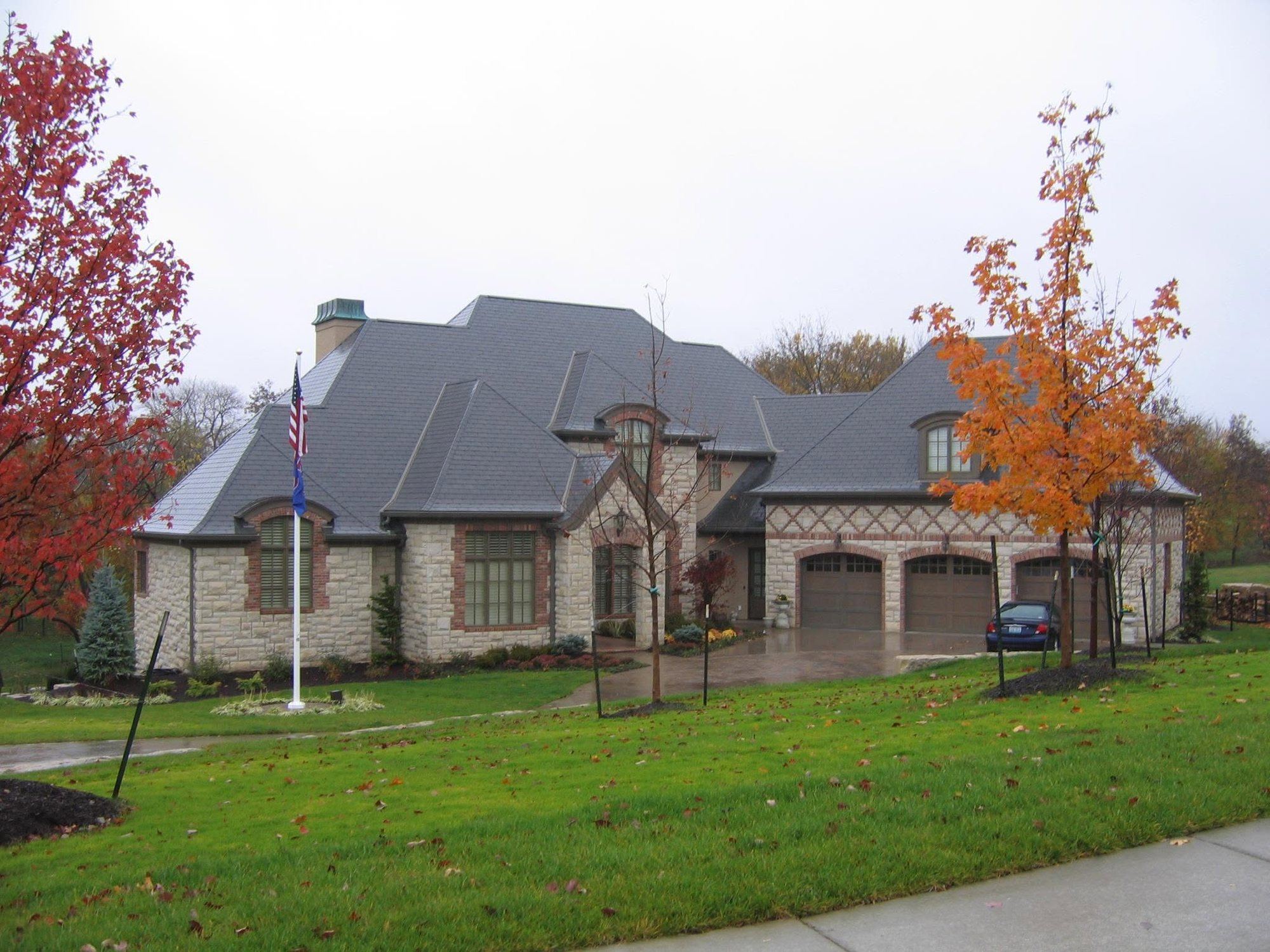 Dimensional Kansas limestone house with brick accents