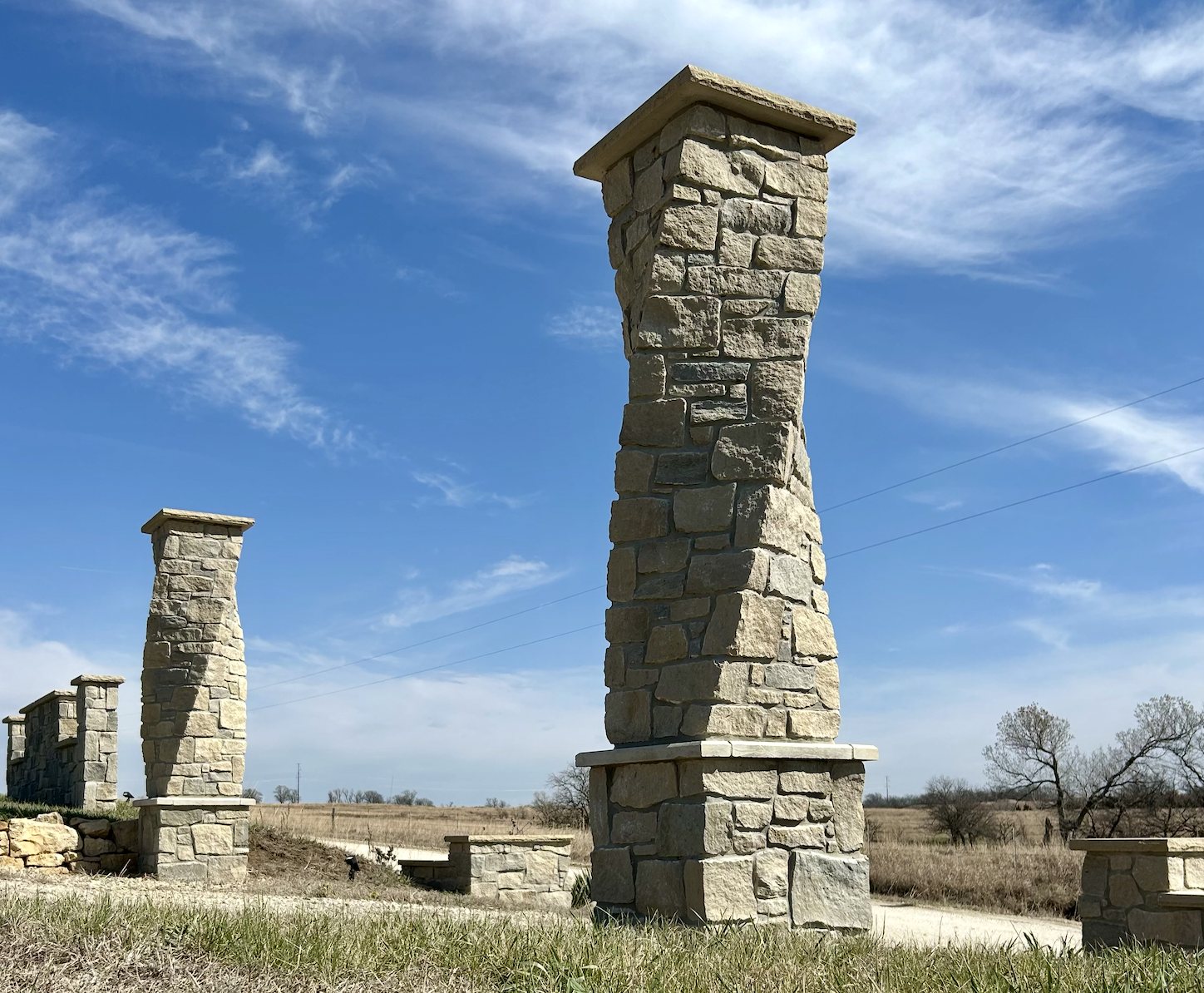 Twisted Kansas limestone columns with cap stones